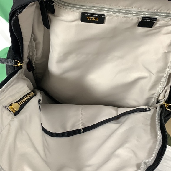 tumi backpack gold zippers - Voyageur Celina - Women's Work and Travel Bag - 16.0" X 10.6" X 6.5" - Holds Up to 16" Laptop Exterior Features This backpack has a double zip entry to main compartment leather top handle two front U TUMI Celina Backpack